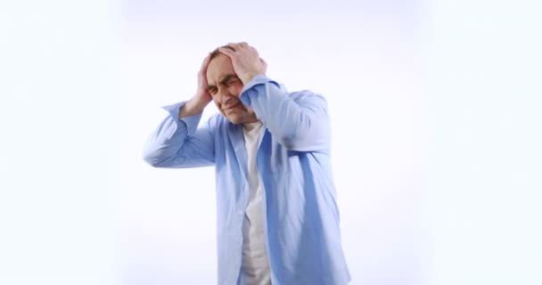 Mature man having terrible headache, isolated on white background. People, stress, tension and migraine concept. — Stock Video