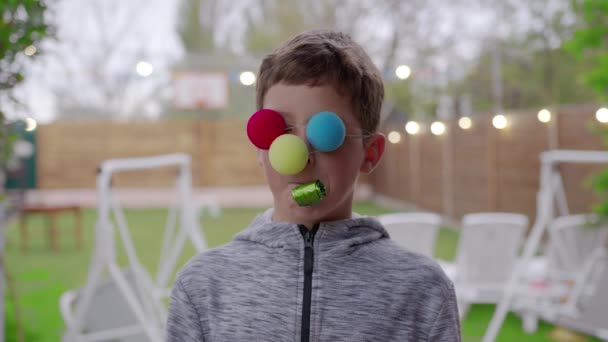 Boy in funny colorful costume in celebration. — Stock Video