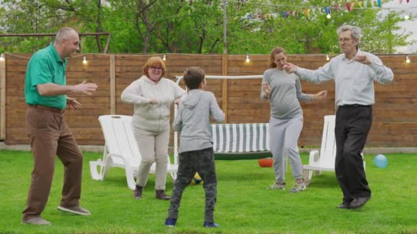 Happy little boy celebrating her birthday with family. — Stock Video