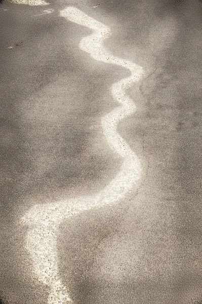 Ligne de mousse de mer sur une plage Images De Stock Libres De Droits