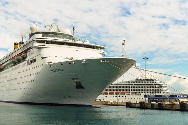 KATAKOLO, GREECE - October 31, 2017: Close-up view from below - Costa Neoclassica & MSC Musica cruise ships anchoring at port of Katakalon, taking tourists visiting ruin of Olympia: the birth place of Olympic games, Greece