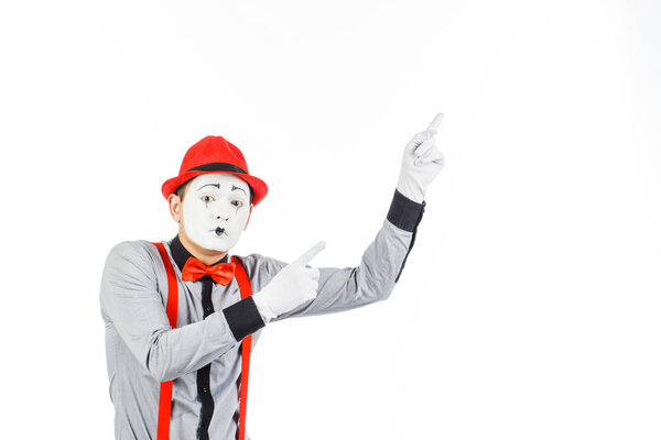 Portrait of a man, artist,clown, MIME. Shows something, isolated