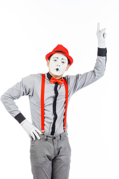 Portrait of a man, artist,clown, MIME. Shows something, isolated