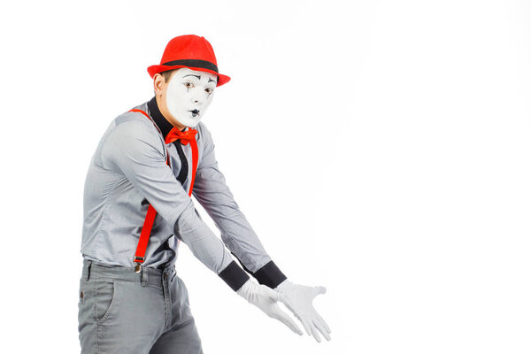 Portrait of a man, artist,clown, MIME. Shows something, isolated