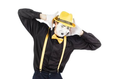 Genç aktör, bir pandomim, ellerini arkasına onun kulaklarını kapatır o