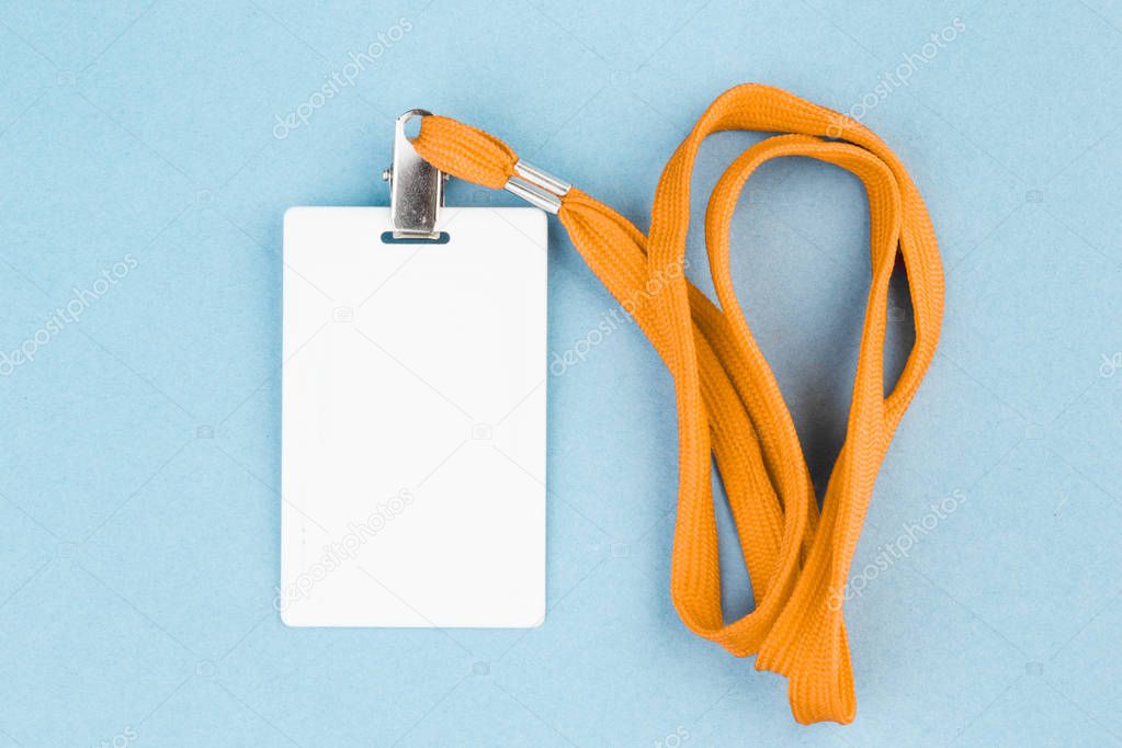 Empty ID card / icon with an orange belt, on a blue background. 