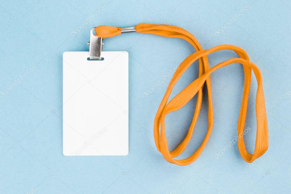 Empty ID card / icon with an orange belt, on a blue background. 