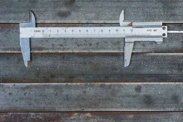 Measuring tools, metal background. Background, texture.