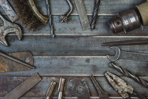 Old tool on rusty old metal slats. Copyspace