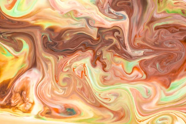 Artistic abstract design created with mixing color liquids. Colo