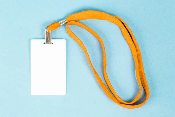 Empty ID card / icon with an orange belt, on a blue background.