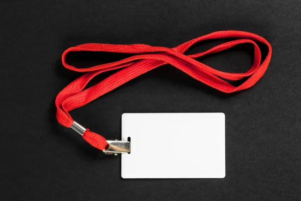 Identificación de la tarjeta vacía / icono con un cinturón naranja sobre un fondo negro . — Foto de Stock