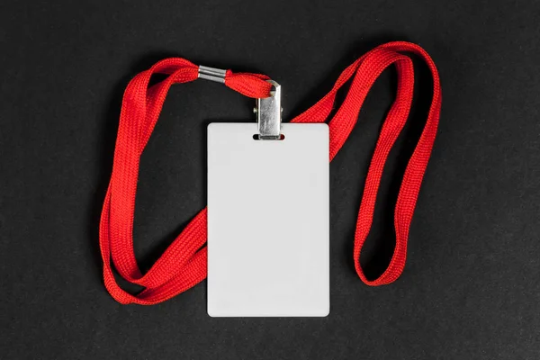 Empty card ID / icon with an orange belt on a black background. — Stock Photo, Image