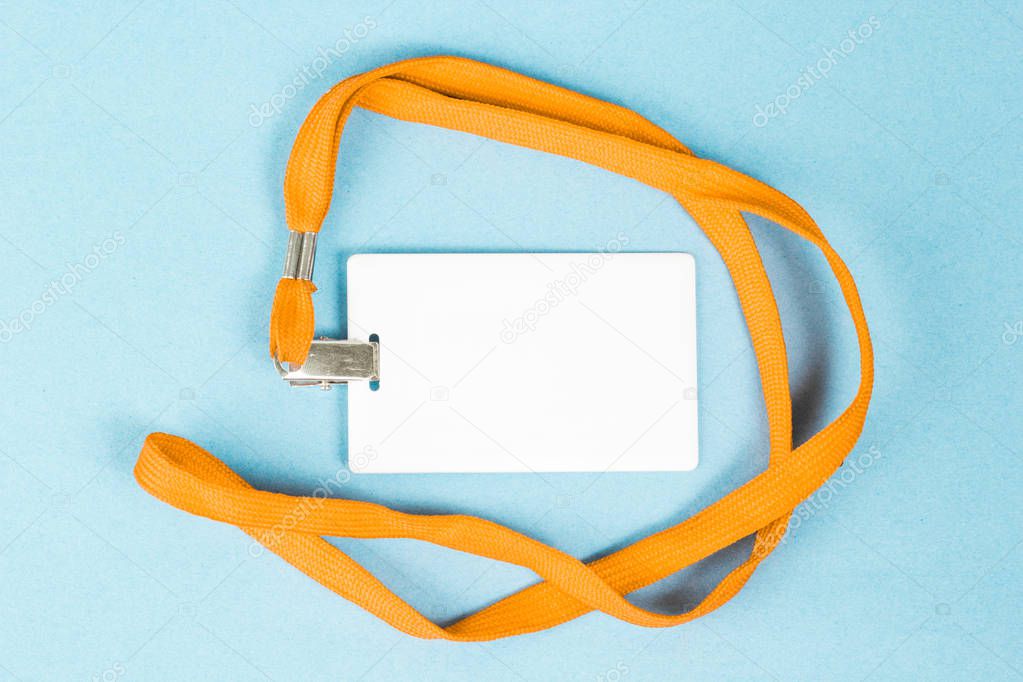 Empty ID card / icon with an orange belt, on a blue background. 