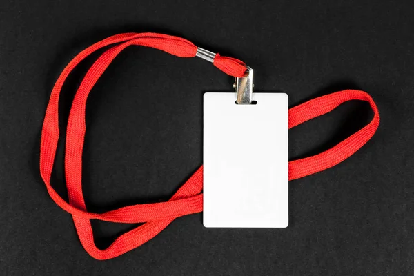 Empty card ID / icon with an orange belt on a black background. — Stock Photo, Image