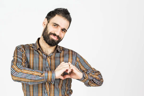 L'uomo fa uscire il cuore dalle mani. su sfondo bianco . — Foto Stock