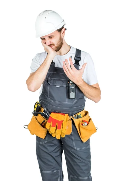 A builder or employee in a protective helmet holds a handle near — Stock Photo, Image