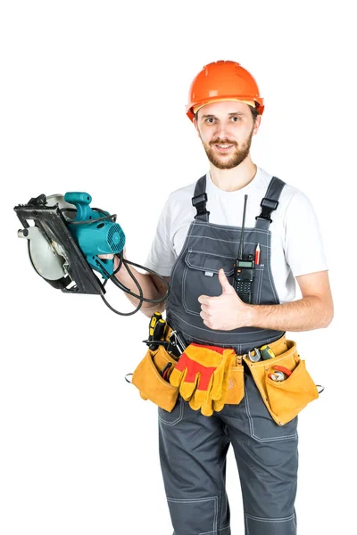 Un constructor o un empleado en un casco protector con un eléctrico —  Fotos de Stock