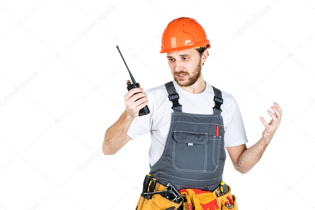 The builder talks, swears on thewalkie-talkie. isolated on white