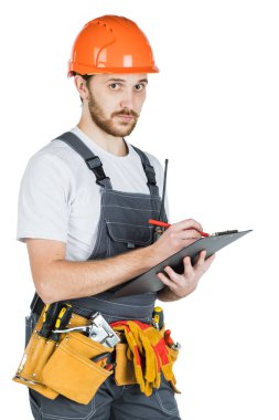 Builder panoya yazar. Beyaz arka plan üzerinde izole.