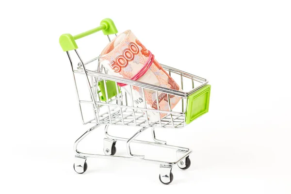 Food trolley, full of Russian 5000 banknotes. On a white background