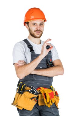 Bir adam oluşturucu bir el hareketi gösterir. Onarım ve inşaat. Beyaz arka plan üzerinde yalıtılmış