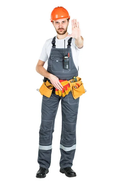 A construction man shows a stop sign. isolated on white backgrou — Stock Photo, Image