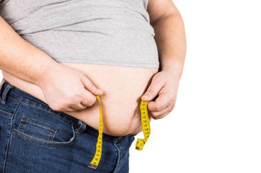 Beyaz arka plan üzerinde izole oryantal sarı ölçüm bandı ölçme kalın olgun adam