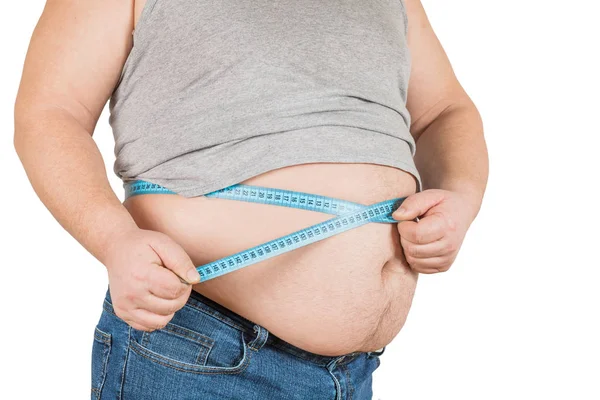 Man, body or measuring tape on waist on studio background for weight loss  management, fat control