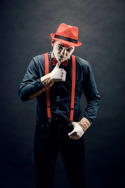Frightened male mime, isolated on black. Lively emotions of an a