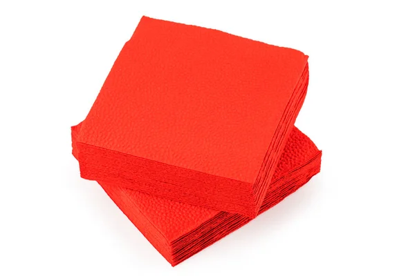 Pile de serviettes en papier rouge propre sur fond blanc. — Photo