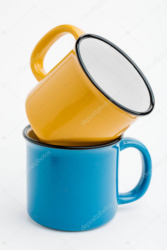 metal mugs on a white isolated background
