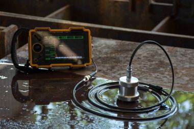 Ultrasonic test to detect imperfection or defect of steel plate  clipart