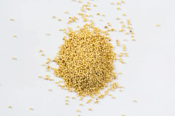 Yellow millet groats background — Stock Photo, Image