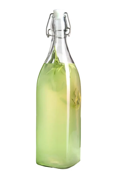 Bottle of refreshing lemonade with tarragon grapes on a white background