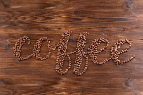 Lettering coffee. Coffee beans in the form of a text coffee — Stock Photo, Image