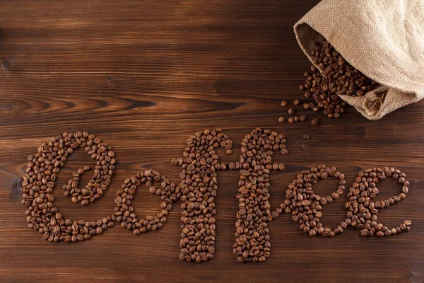 Lettering coffee. Coffee beans in the form of a text coffee — Stock Photo, Image