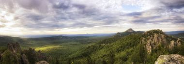 Panoramic view of the mountains and cliffs, South Ural. Summer in the mountains. clipart