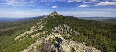 Panoramic view of the mountains and cliffs, South Ural. Summer in the mountains.View from the mountains. clipart