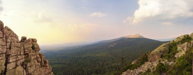 Panoramic view of the mountains and cliffs, South Ural. Summer in the mountains.View from the mountains. The nature of the southern Urals. clipart