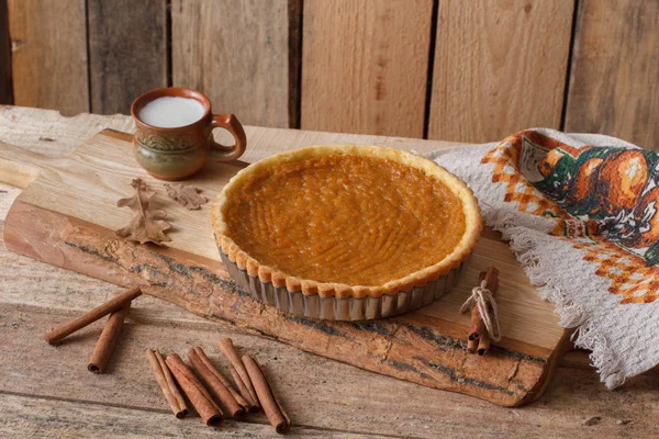 Fresh Homemade Pumpkin Pie made for Thanksgiving. Pie on a wooden background. Rustic. — Stock Photo, Image