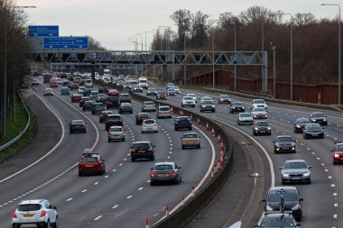 Hunton Bridge, UK - February 23, 2020: Evening traffic on busiest British motorway M25