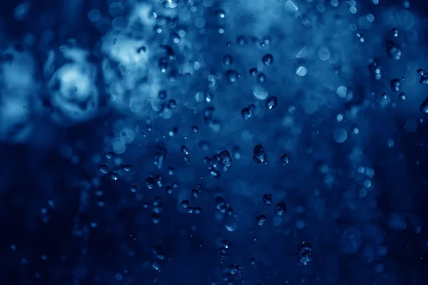 Blue spray fountain at night — Stock Photo, Image