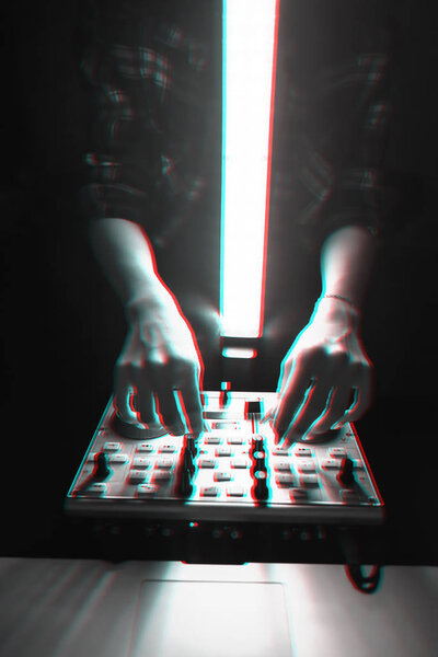 DJ mixer disco illuminated by searchlights