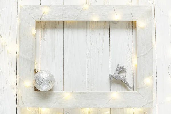 New Year background of bright garlands on a wooden — Stock Photo, Image