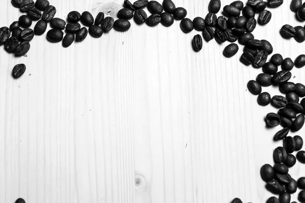 Coffee beans on the table — Stock Photo, Image