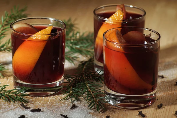 Hot wine drink. Warm Christmas wine. Mulled wine with oranges an