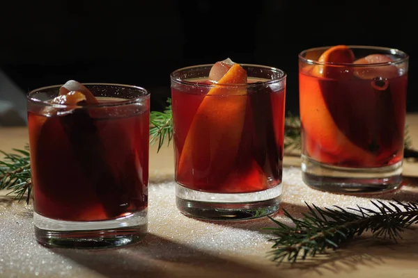 Hot wine drink. Warm Christmas wine. Mulled wine with oranges an