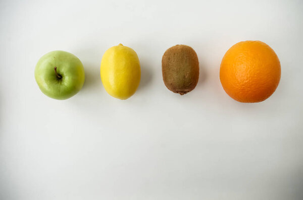 Background of fresh sliced fruit on a table in the afterno