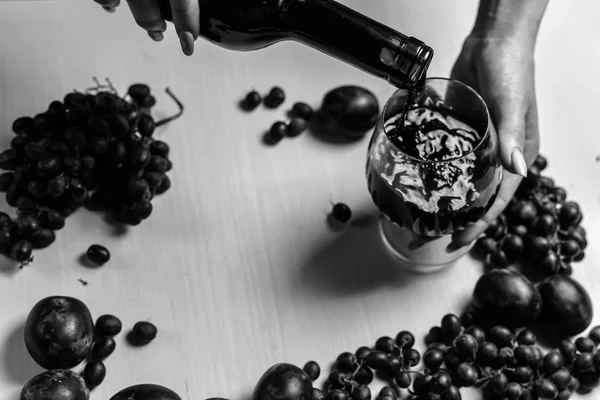 Composition of wine, grape and plums — Stock Photo, Image